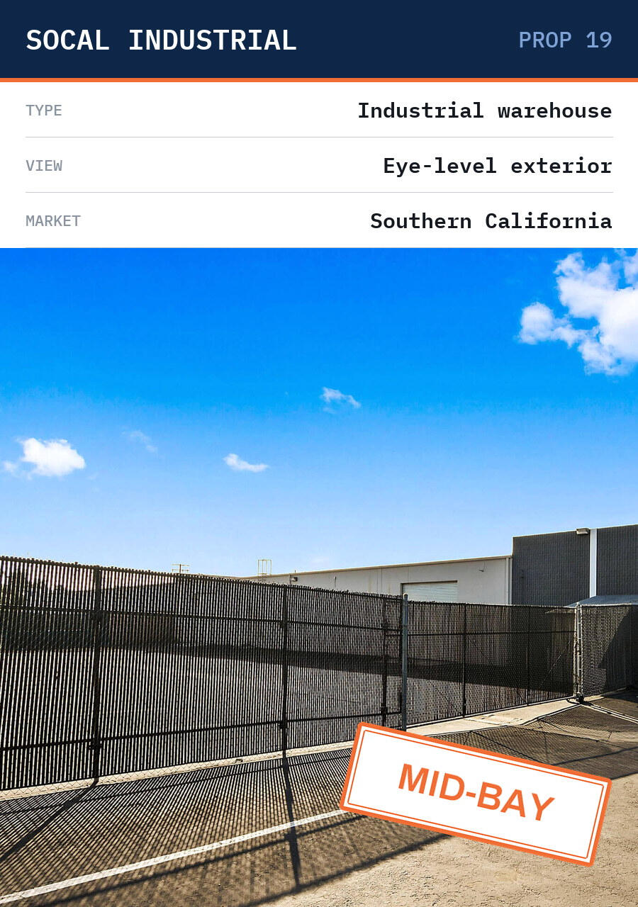 Eye-level exterior of a mid-bay industrial warehouse in Southern California.